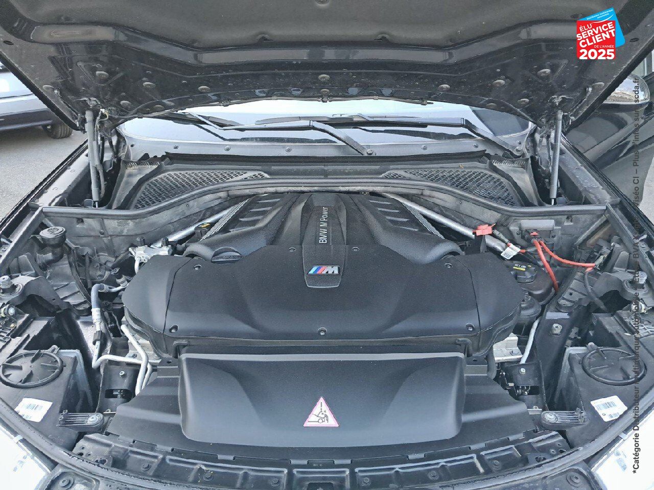Véhicule d'occasion BMW X6 M 575CH BVA8 TOUVRANT SIEGES CHAUF/CUIR CAMERA H/KARDON HUD chez BMW Besançon